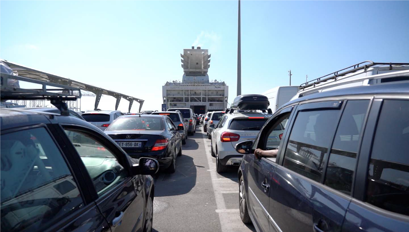 Cars of Moroccan living in Europe entering a Ferry